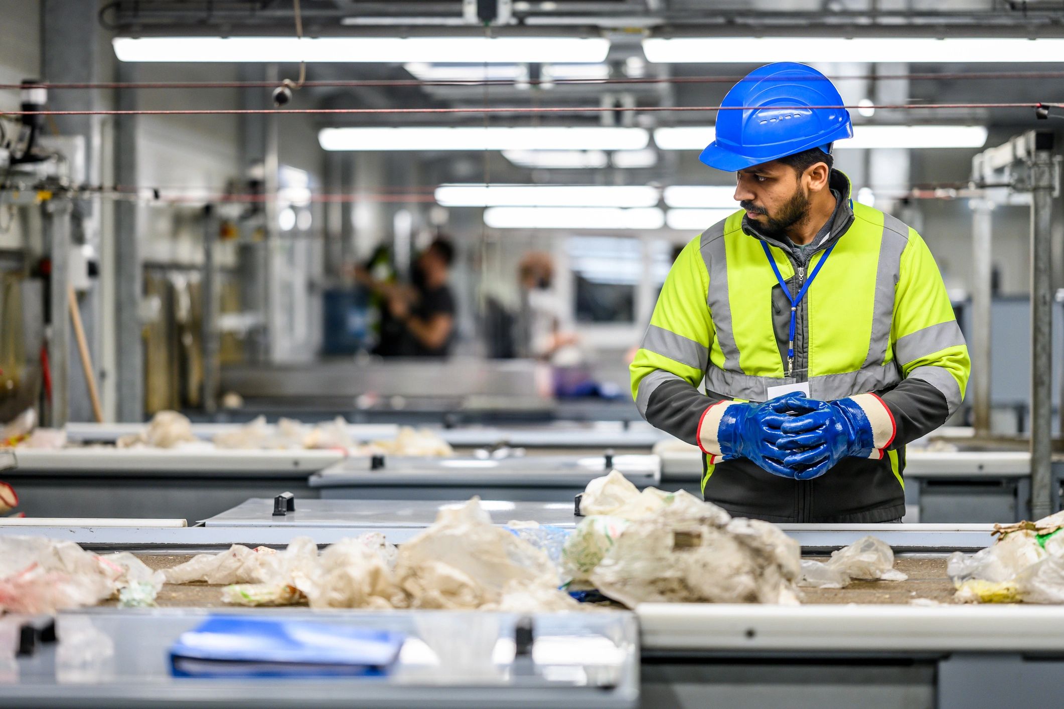 Team member inspecting products in a quality-focused processing environment